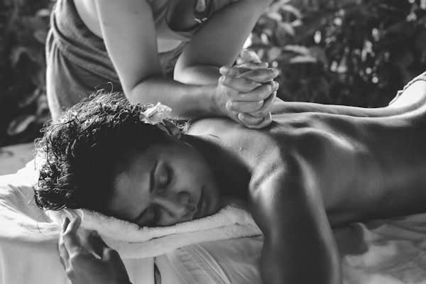 Couples massage in a relaxing home setting