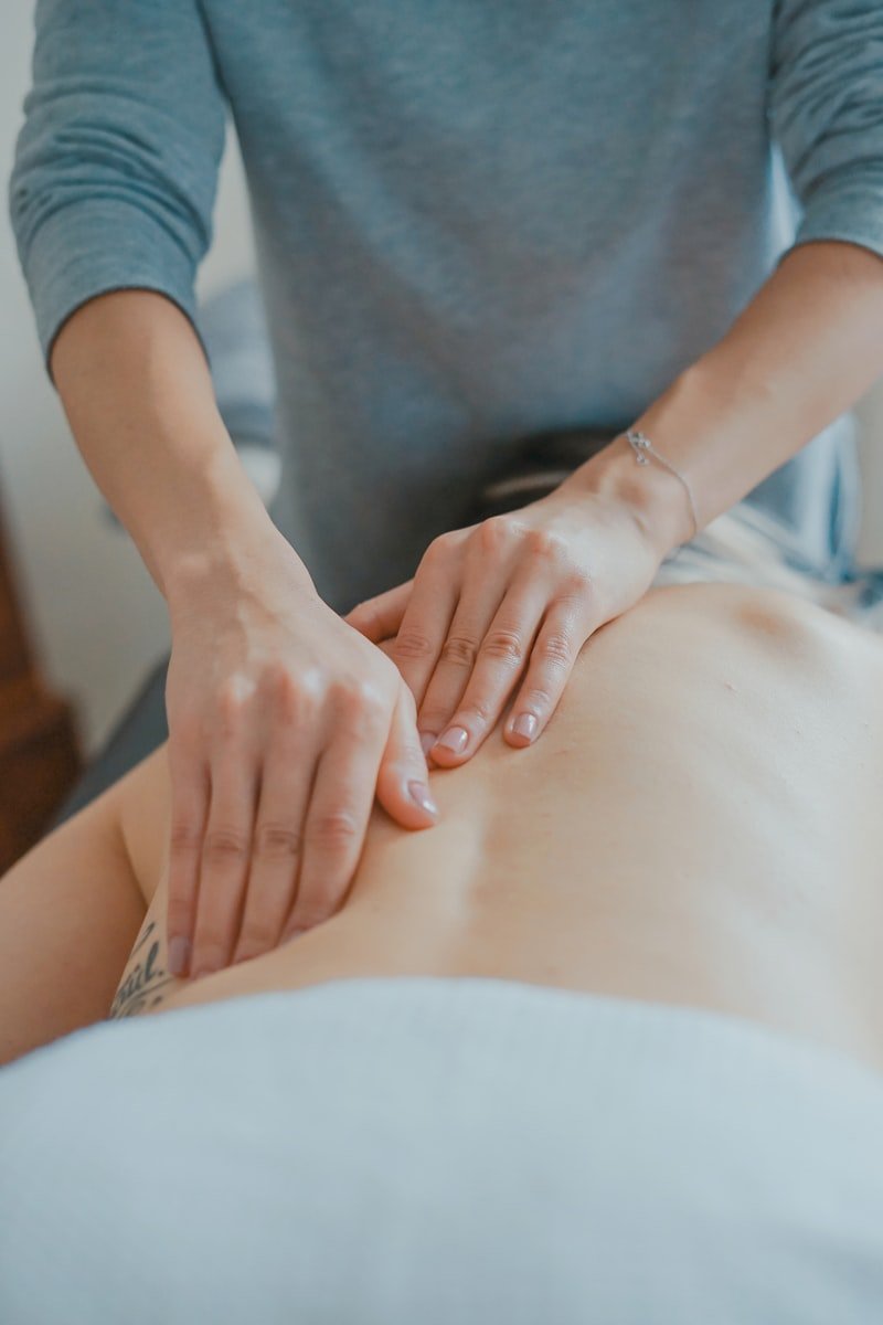 Cupping therapy treatment being performed on a client's back